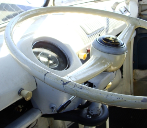 TAKE THE WHEEL -- Steering wheel a little worse for wear in a '66 VW bus.